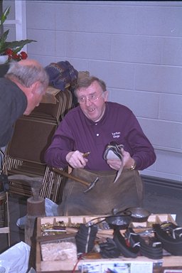 Mr. Turton making clogs at Wigan Clog Festival.